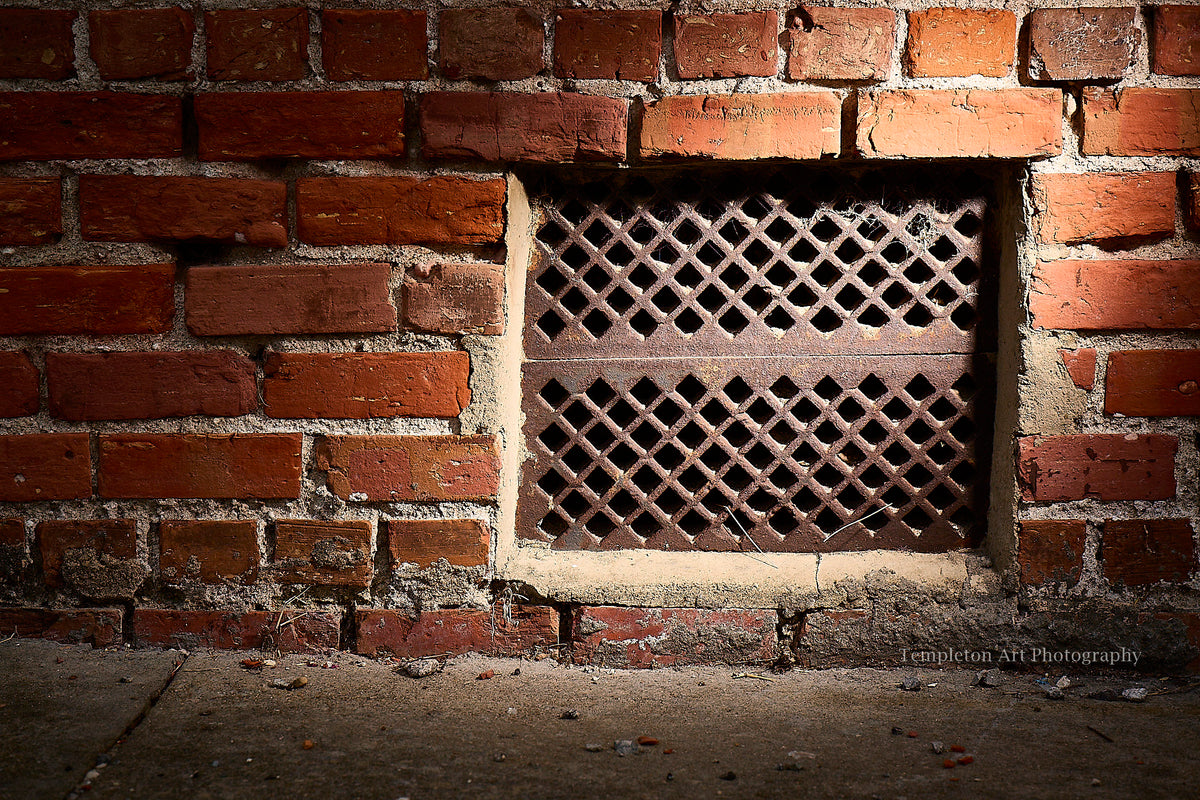 Cast Iron Grate In Brick Wall